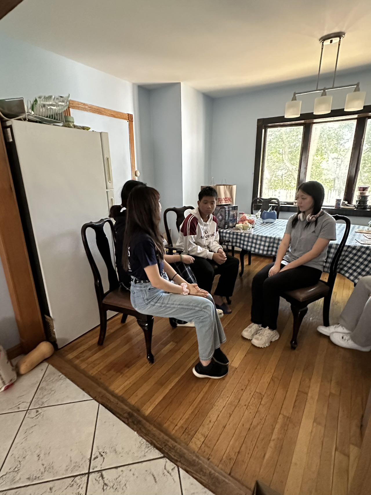 Volunteers sitting together for a conversation during a visit