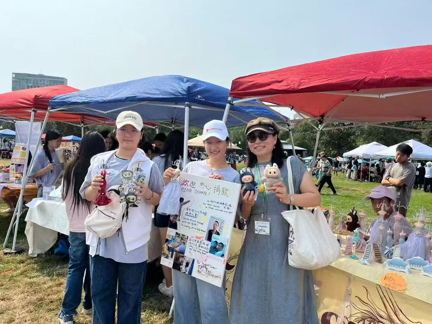 Volunteers sharing their fundraising work at the 2025 charity sale